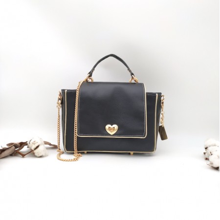 Le sac à main, noir et blanc en cuir végane